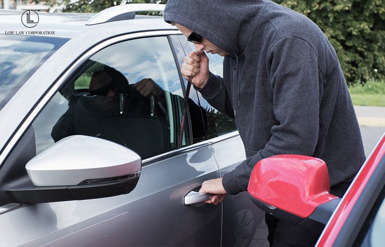 Person breaking into a car