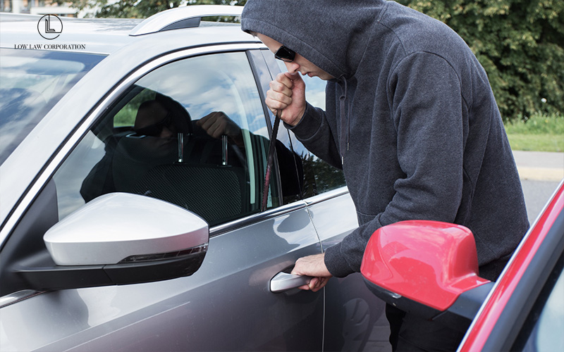 Person breaking into a car